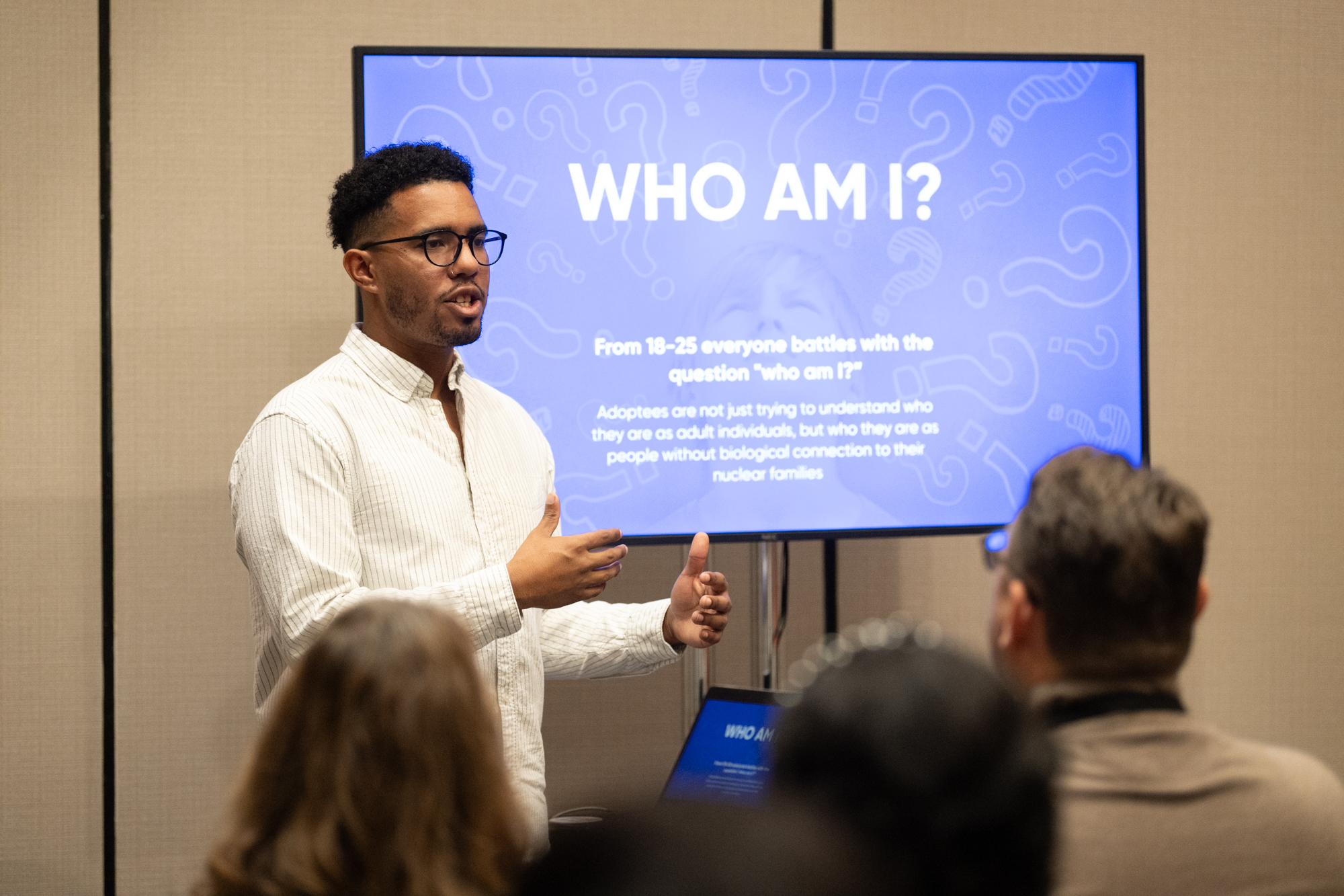 Isaac Etter presenting at adoption conference